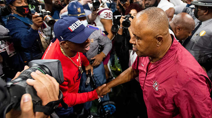 Jackson State head coach Deion Sanders and South Carolina State head coach Oliver Pough shake hands at midfield following the Celebration Bowl.